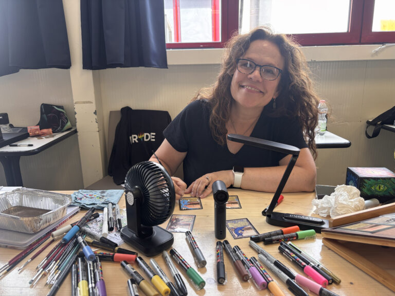 Nicola signing cards in Balogna, Italy, June 2026